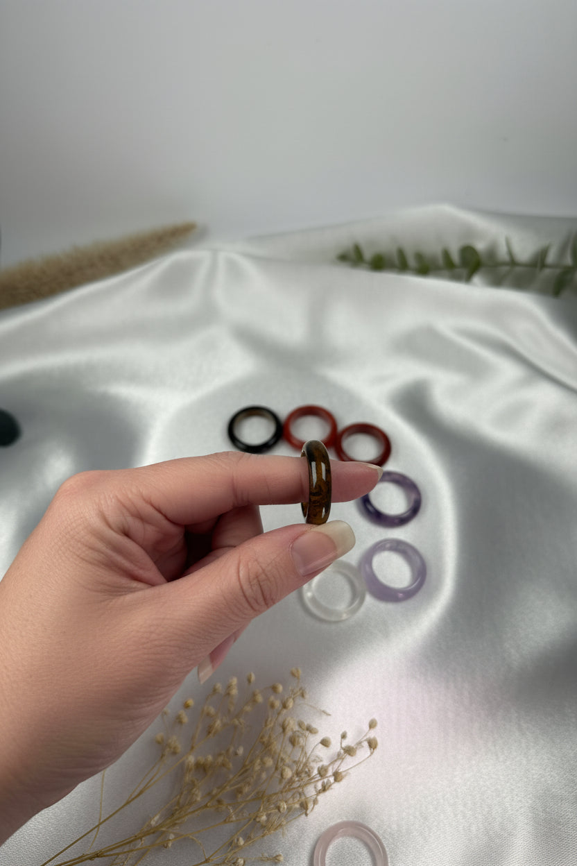 Treasured Energies crystal sphere holders held between fingers showing size and detail