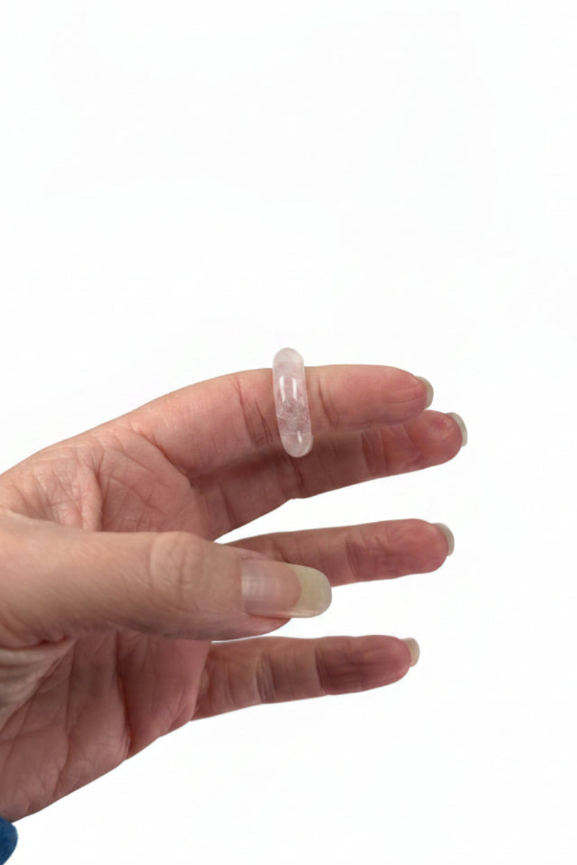 Treasured Energies crystal sphere holders worn on a finger close up