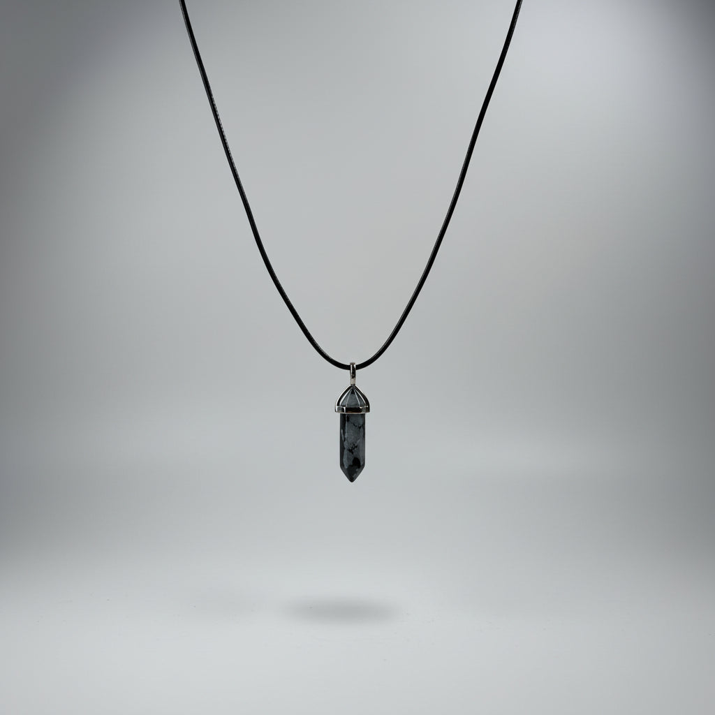Snowflake obsidian necklace with a dark crystal point pendant on a black cord