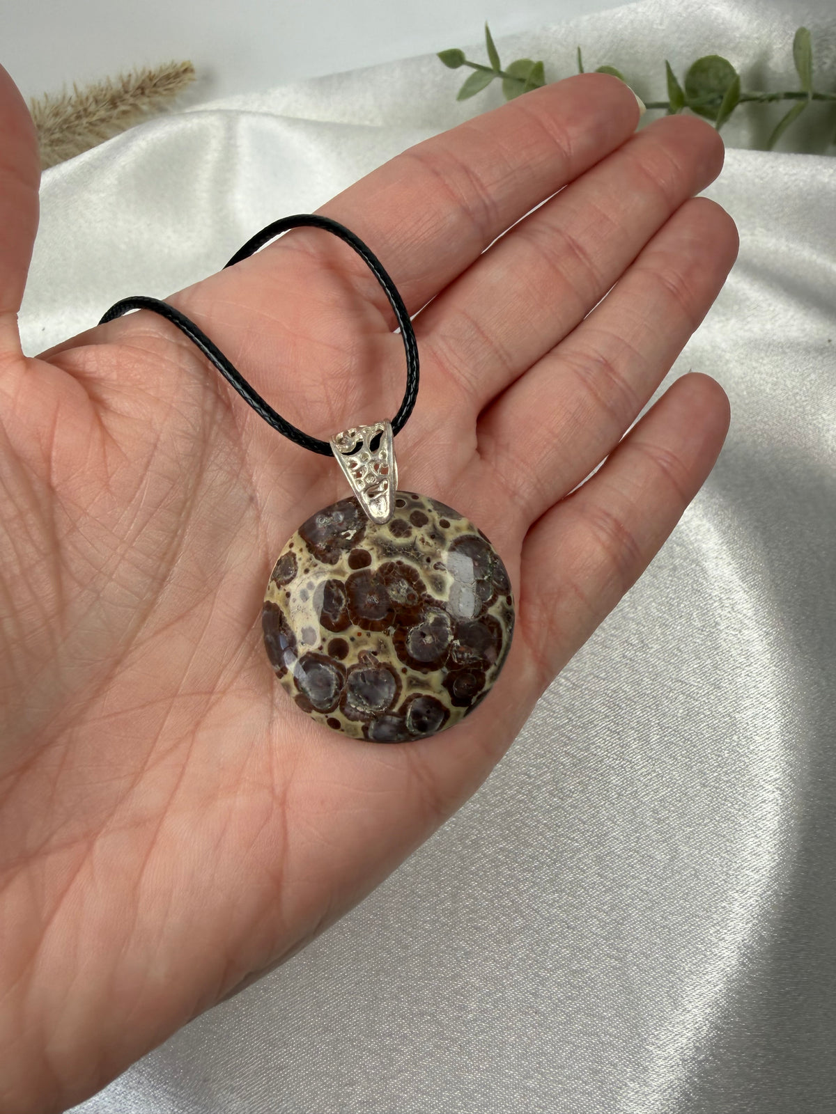 Poppy Jasper Round held in hand