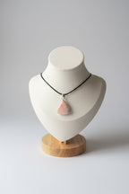 Treasured Energies scolecite teardrop pendant necklace on a white jewellery bust display