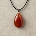 Carnelian Gemstone Teardrop Pendant on Linen Close-Up