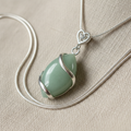 Green Jade Pendant on Linen Close-Up