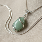 Green Jade Pendant on Linen Close-Up