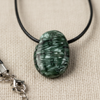 Seraphinite Pendant on Linen Close-Up