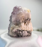 Treasured Energies natural amethyst crystal cluster specimen with purple points and raw white mineral base