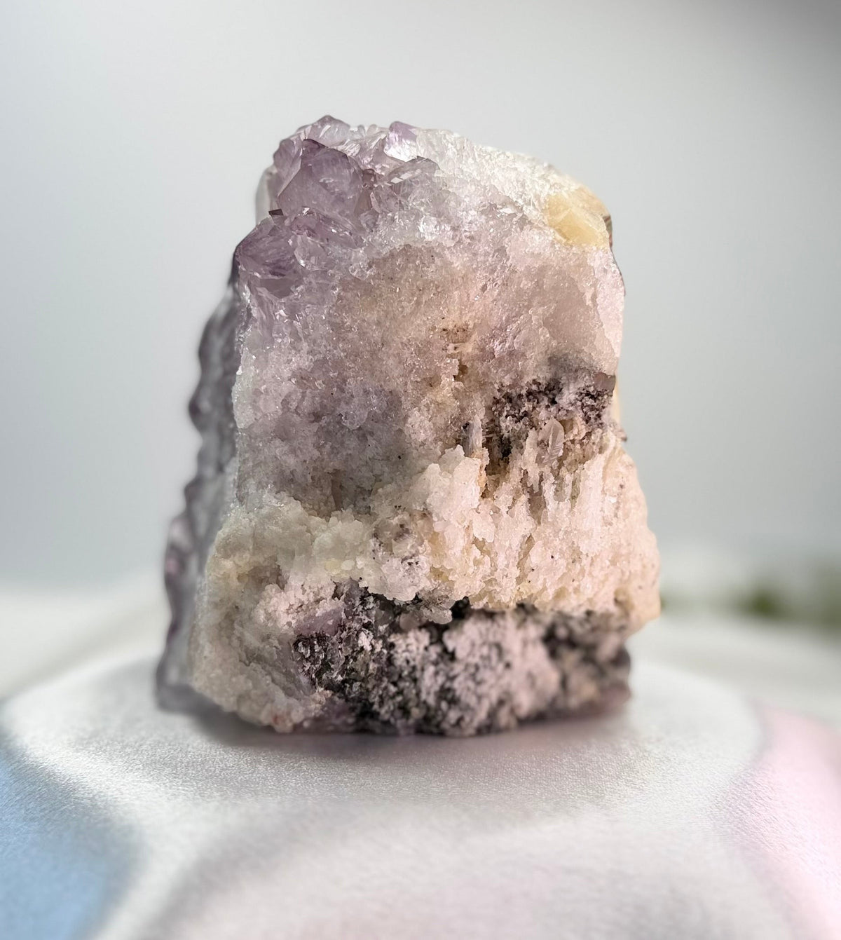 Treasured Energies natural amethyst crystal cluster specimen with purple points and raw white mineral base