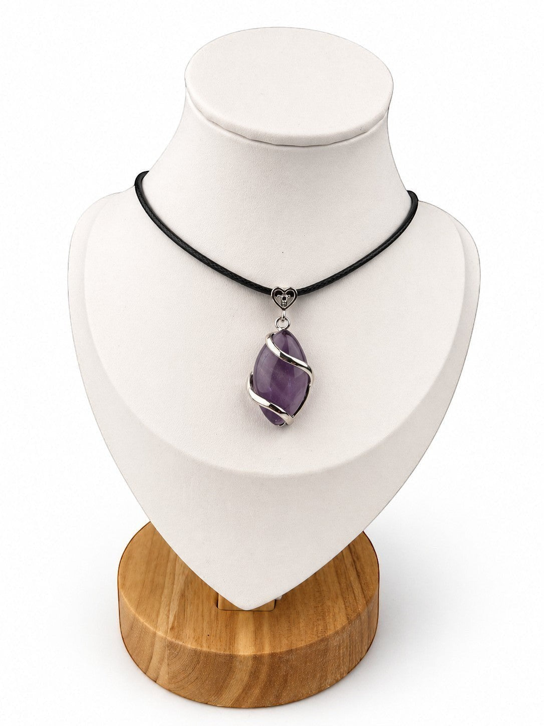Treasured Energies amethyst crystal pendant on a black cord necklace displayed on a white mannequin bust