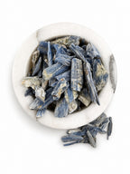Treasured Energies natural blue kyanite crystal stones in a white marble bowl for meditation and healing