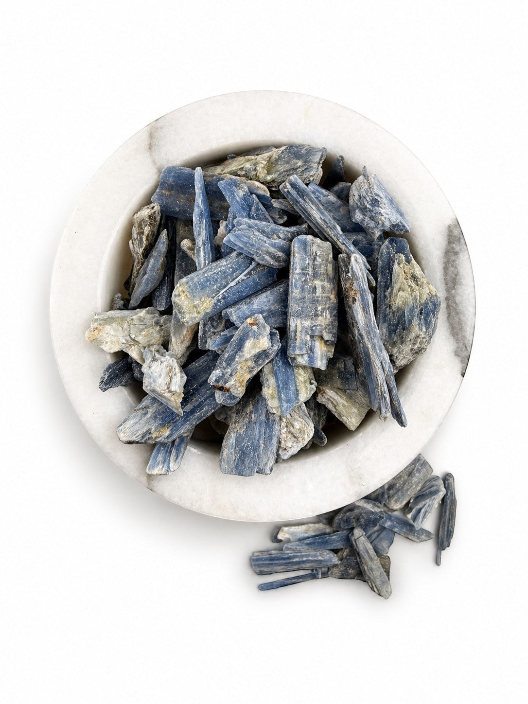 Treasured Energies natural blue kyanite crystal stones in a white marble bowl for meditation and healing