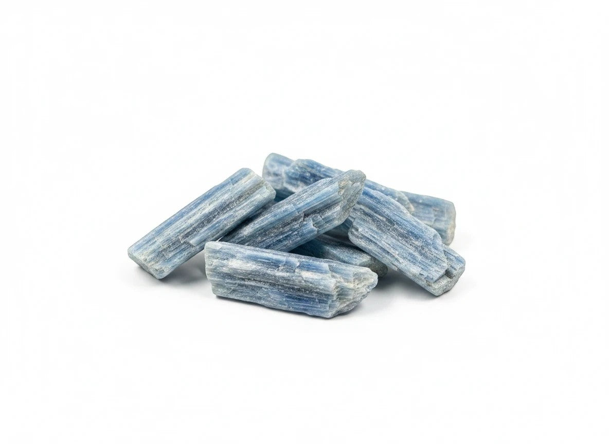 Treasured Energies tumbled blue kyanite crystals with natural striated texture and vibrant blue hues on white background.
