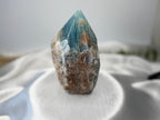 Treasured Energies Blue Onyx crystal tower with a raw, earthy base and a smooth, polished blue point for meditation.