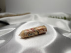 Treasured Energies Crazy Lace Agate crystal tower with intricate swirling patterns in cream, red, and brown tones.