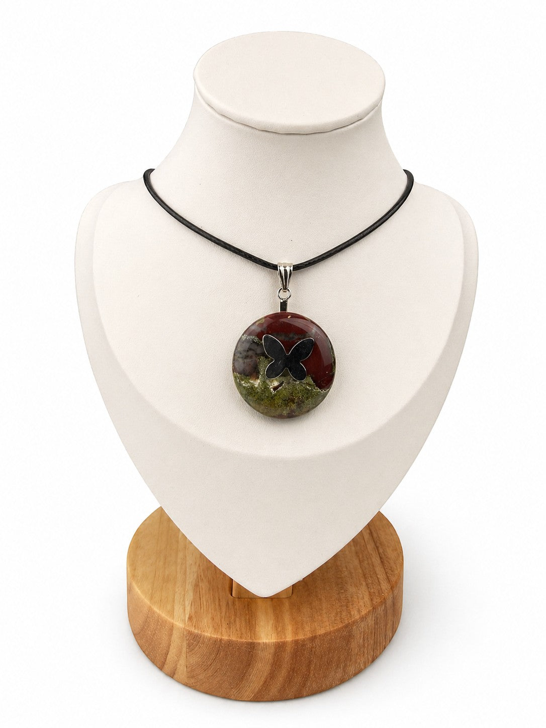 Treasured Energies Dragon Blood Jasper donut ring necklace with a black butterfly pendant on a black cord