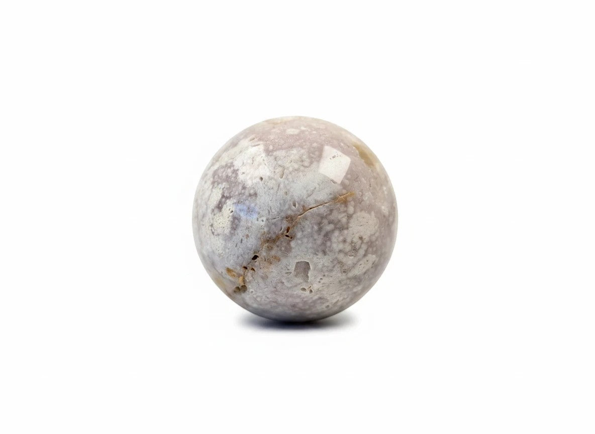 Treasured Energies flower agate crystal sphere with natural druzy inclusions and soft pink and white floral patterns.