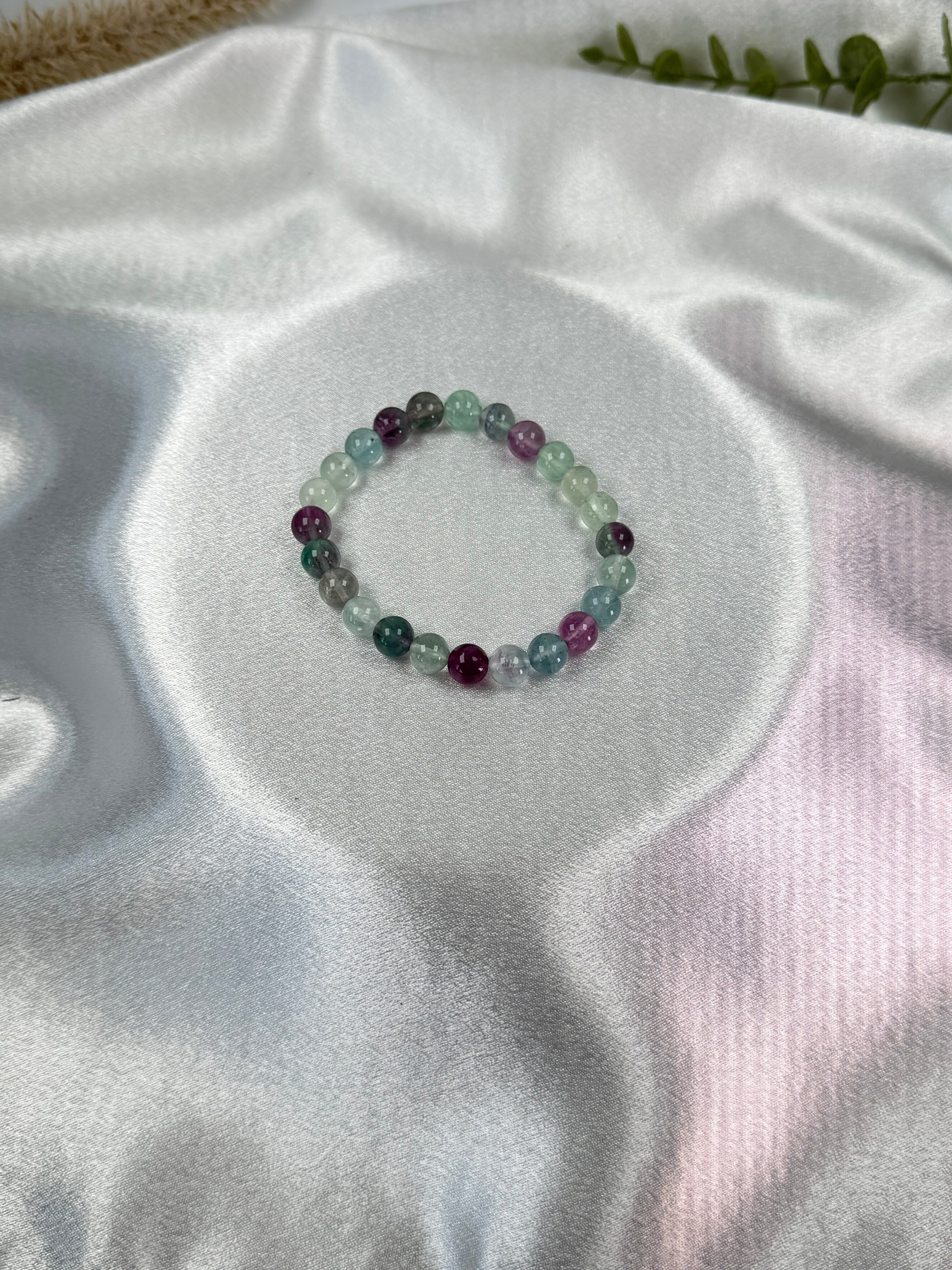 Treasured Energies fluorite gemstone beaded stretch bracelet with purple and green translucent crystal beads on silk