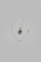 Treasured Energies green aventurine crystal pendant necklace with a silver wire wrap on a delicate chain