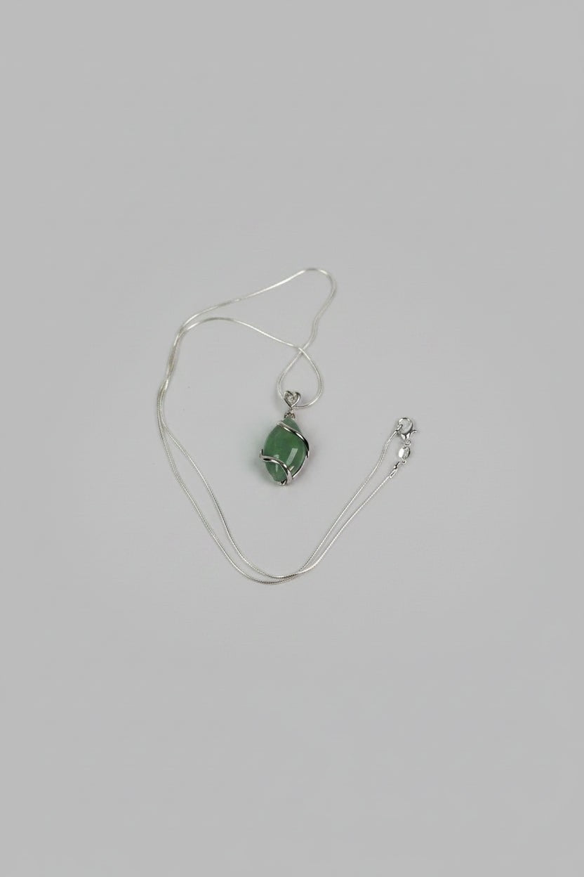 Treasured Energies green aventurine crystal pendant necklace with a silver wire wrap on a delicate chain