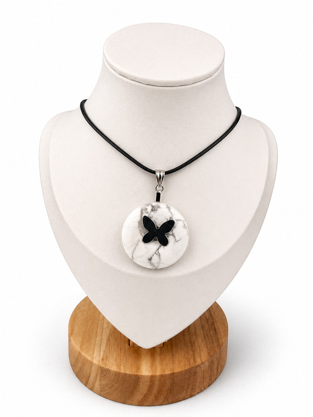 Treasured Energies white Howlite donut ring necklace with a black butterfly pendant on a black cord