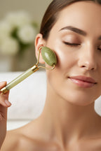 Treasured Energies jade facial massage rollers with dual-ended stones and gold-tone metal frames for skincare.