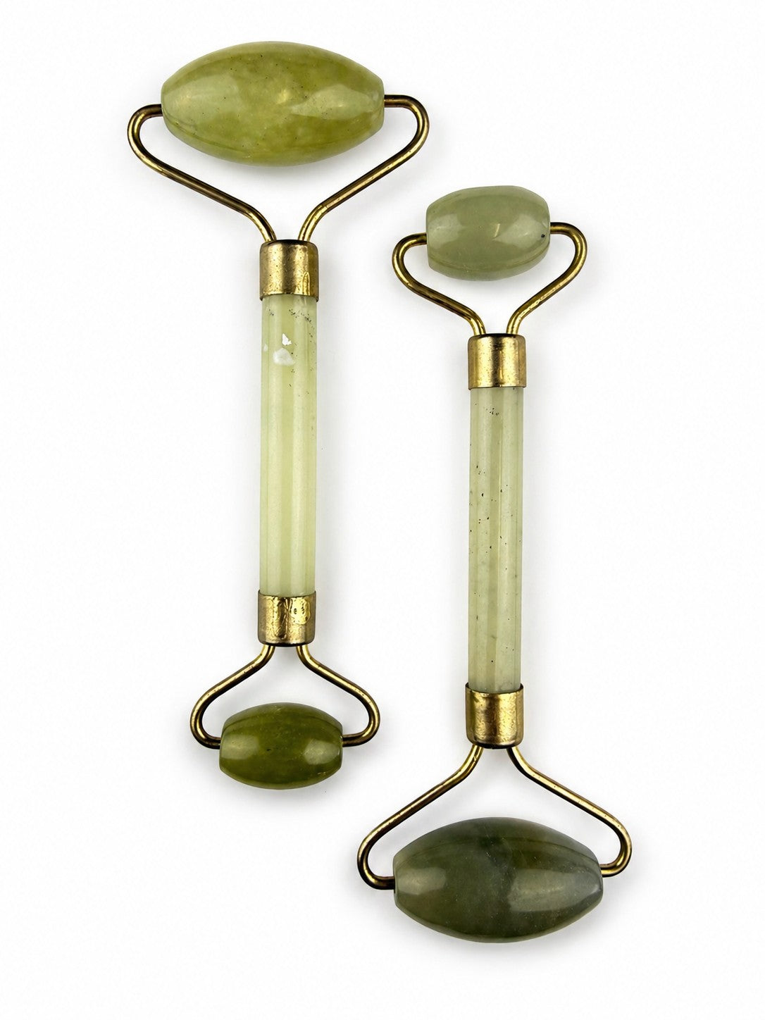 Treasured Energies dual-ended jade facial massage rollers with gold-tone metal hardware for skincare and lymphatic care.
