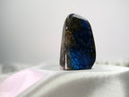 Treasured Energies polished labradorite freeform crystal with vibrant blue labradorescence and organic stone texture.