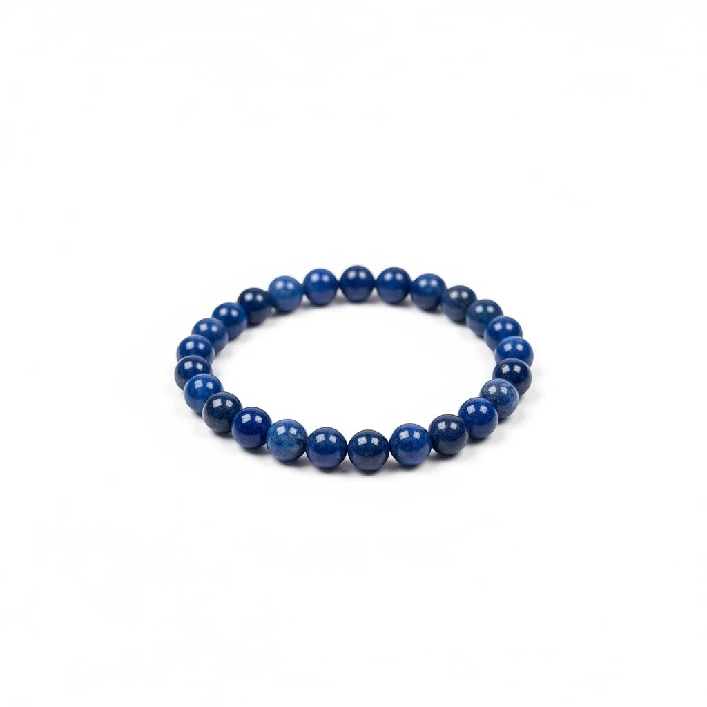 Treasured Energies elastic bracelet featuring polished deep blue Lapis Lazuli gemstone beads on a white background.