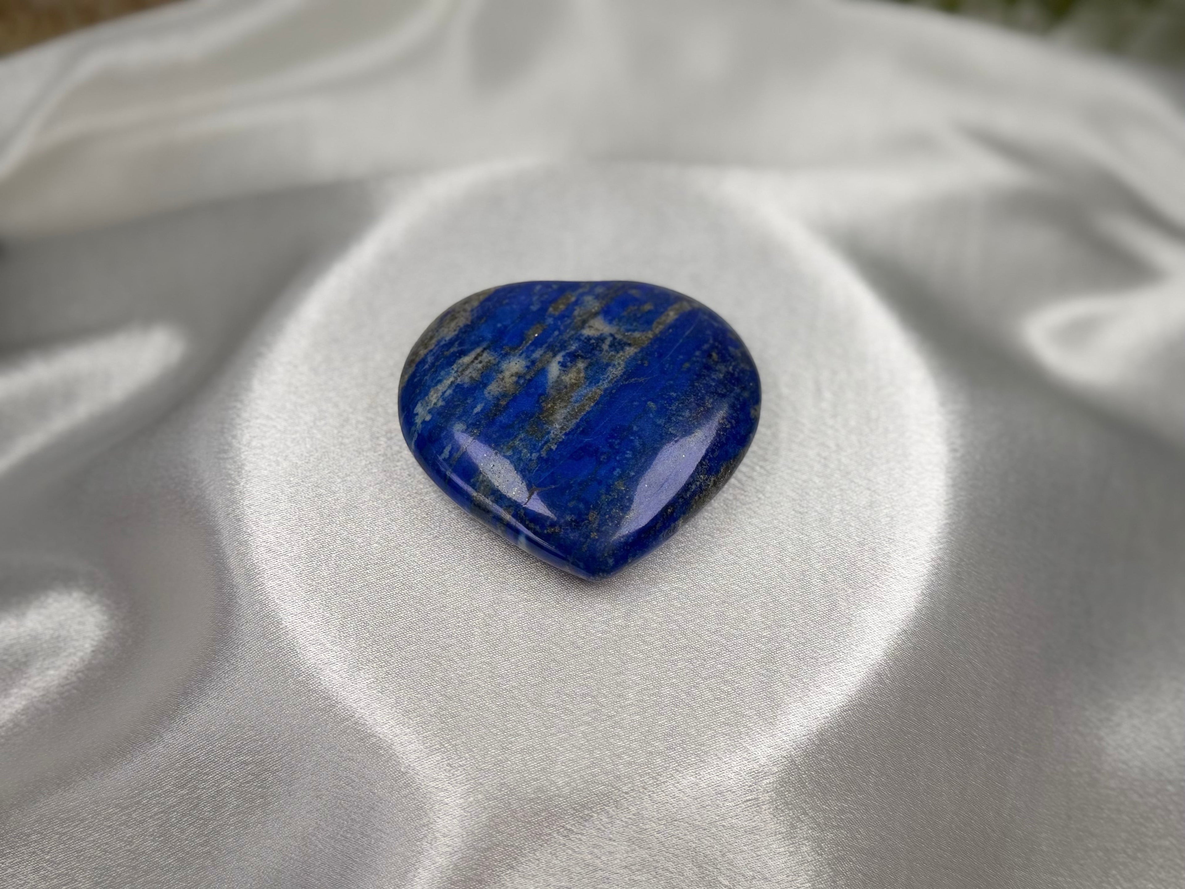 Treasured Energies large heart-shaped Lapis Lazuli crystal with deep blue colour, gold pyrite, and white calcite.