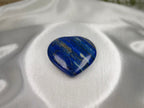Treasured Energies large polished Lapis Lazuli heart stone with deep blue colour and golden pyrite inclusions.