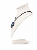 Treasured Energies Lapis Lazuli crystal pendant in a silver wire wrap on a black cord necklace displayed on a bust