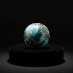 Treasured Energies polished Larimar sphere with oceanic blue and white patterns and brown mineral inclusions