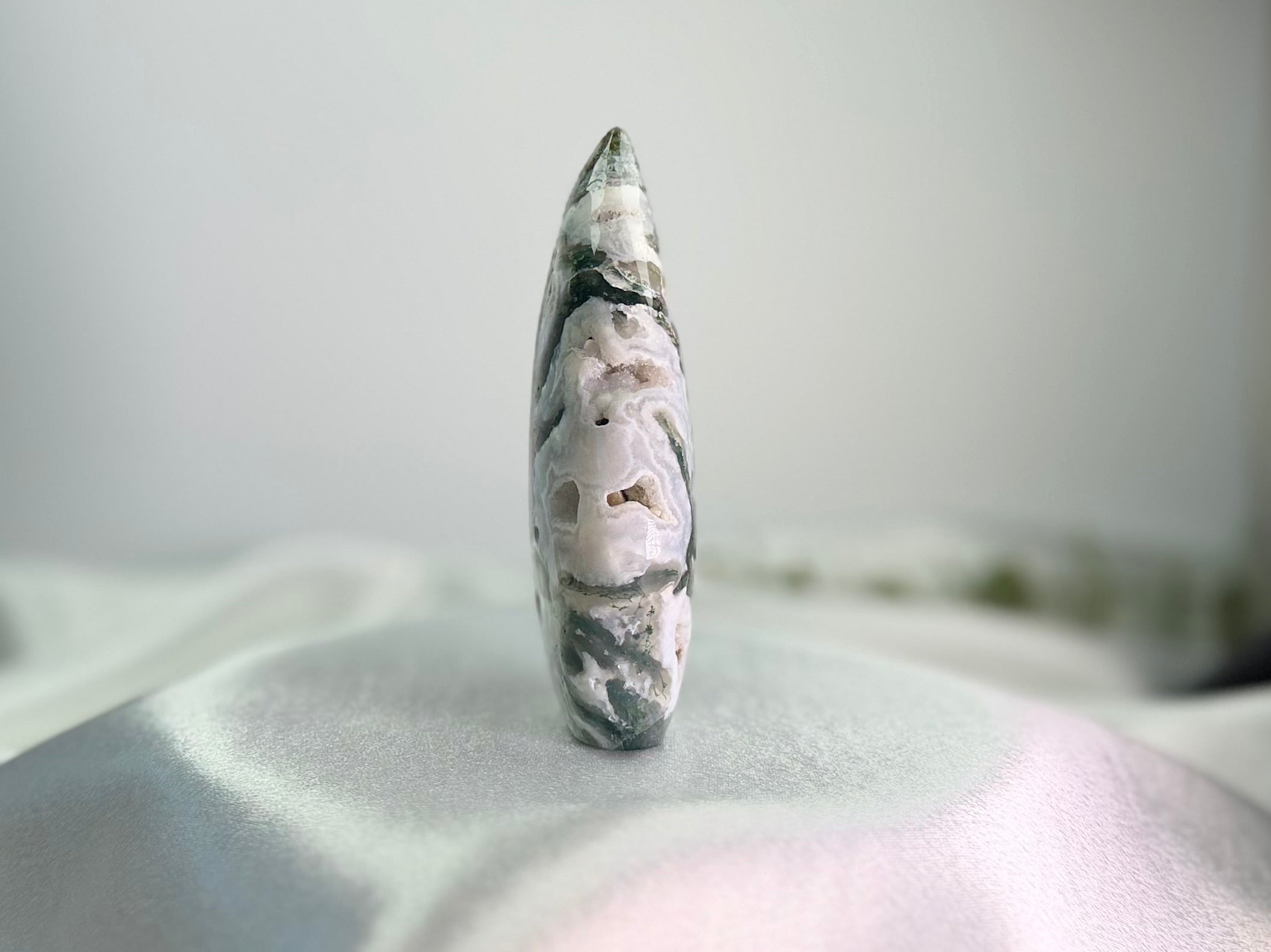 Treasured Energies polished moss agate flame crystal sculpture with green inclusions and natural banding