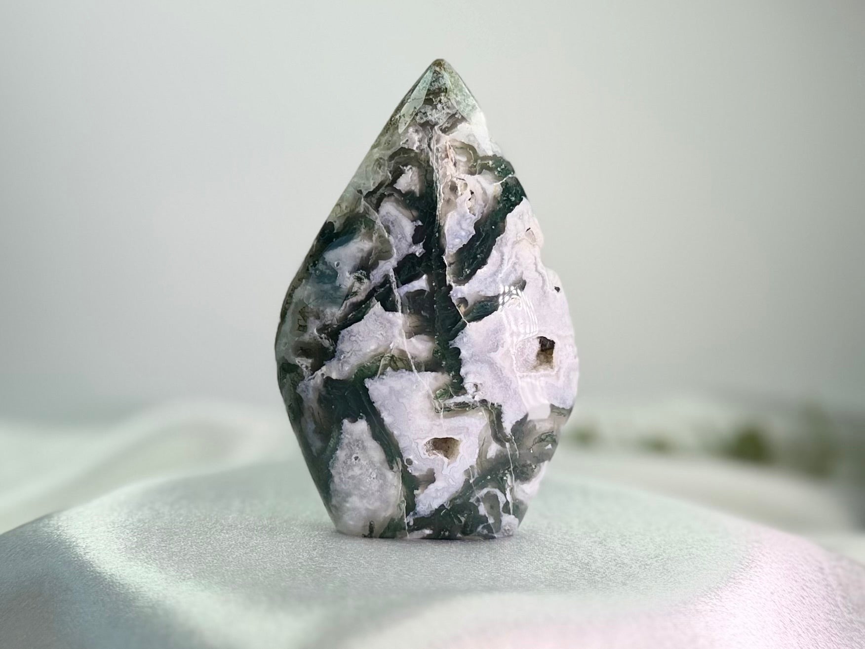 Treasured Energies polished moss agate flame crystal sculpture with green and white organic mineral patterns.