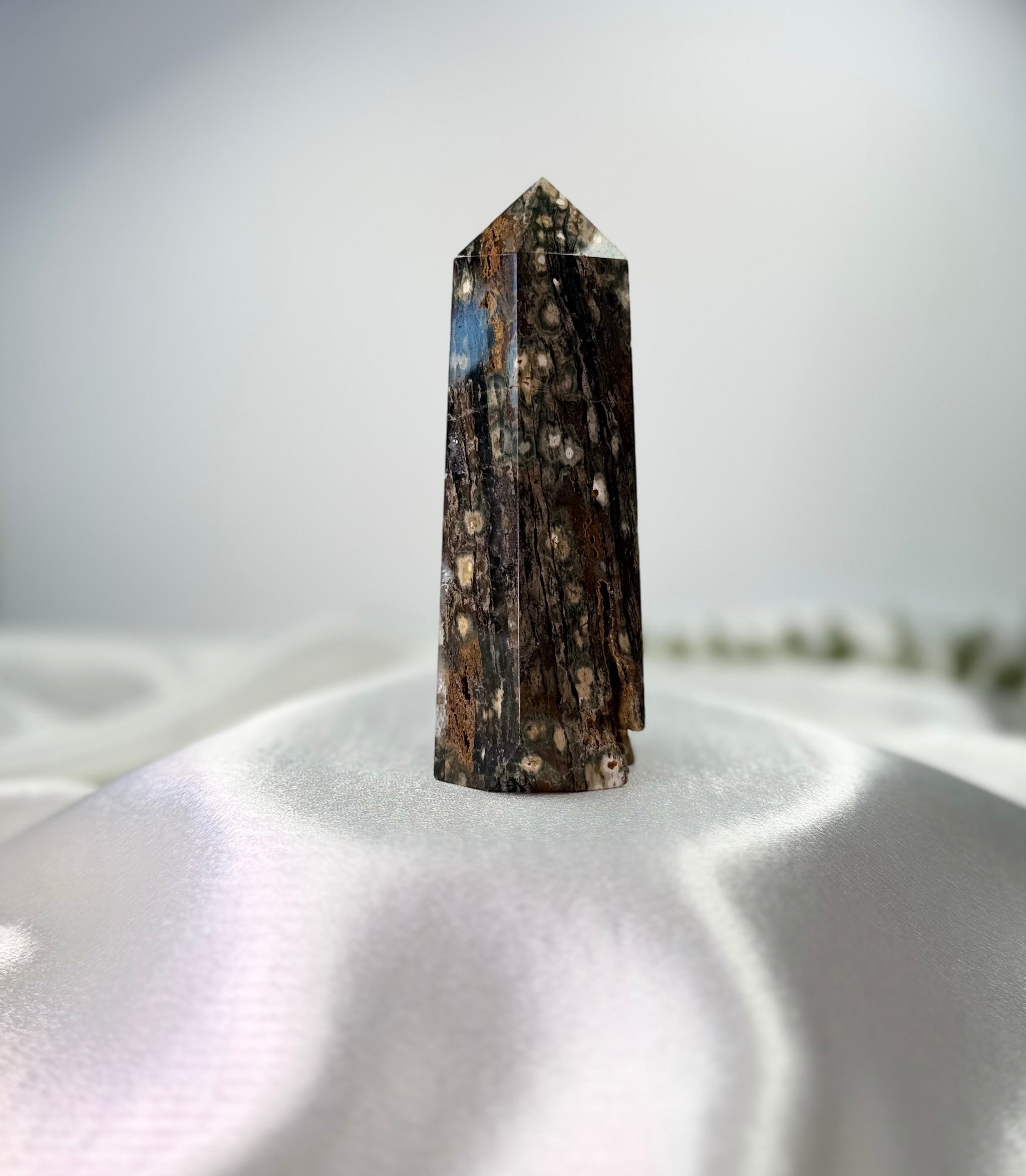 Treasured Energies polished Ocean Jasper crystal tower with dark brown, white, and blue orbicular patterns.