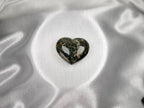 Treasured Energies large polished Ocean Jasper crystal heart with dark green and brown patterns on white satin.