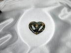 Treasured Energies large polished Ocean Jasper crystal heart with green and cream patterns on white satin fabric