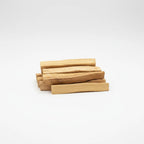 Treasured Energies natural palo santo wood sticks for smudging and aromatherapy stacked on a white background
