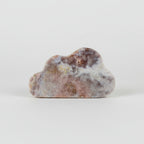 Treasured Energies pink amethyst crystal carved into a smooth cloud shape with natural mineral patterns.