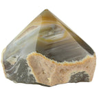 Treasured Energies polished agate point with natural grey and beige banding and raw textured base.