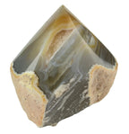 Treasured Energies polished agate point with natural grey and white banding and a raw, textured base.
