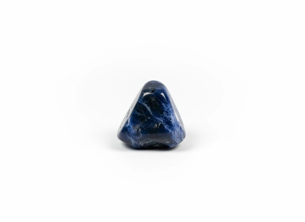 Treasured Energies polished sodalite tumbled stone with deep royal blue colour and white mineral inclusions.