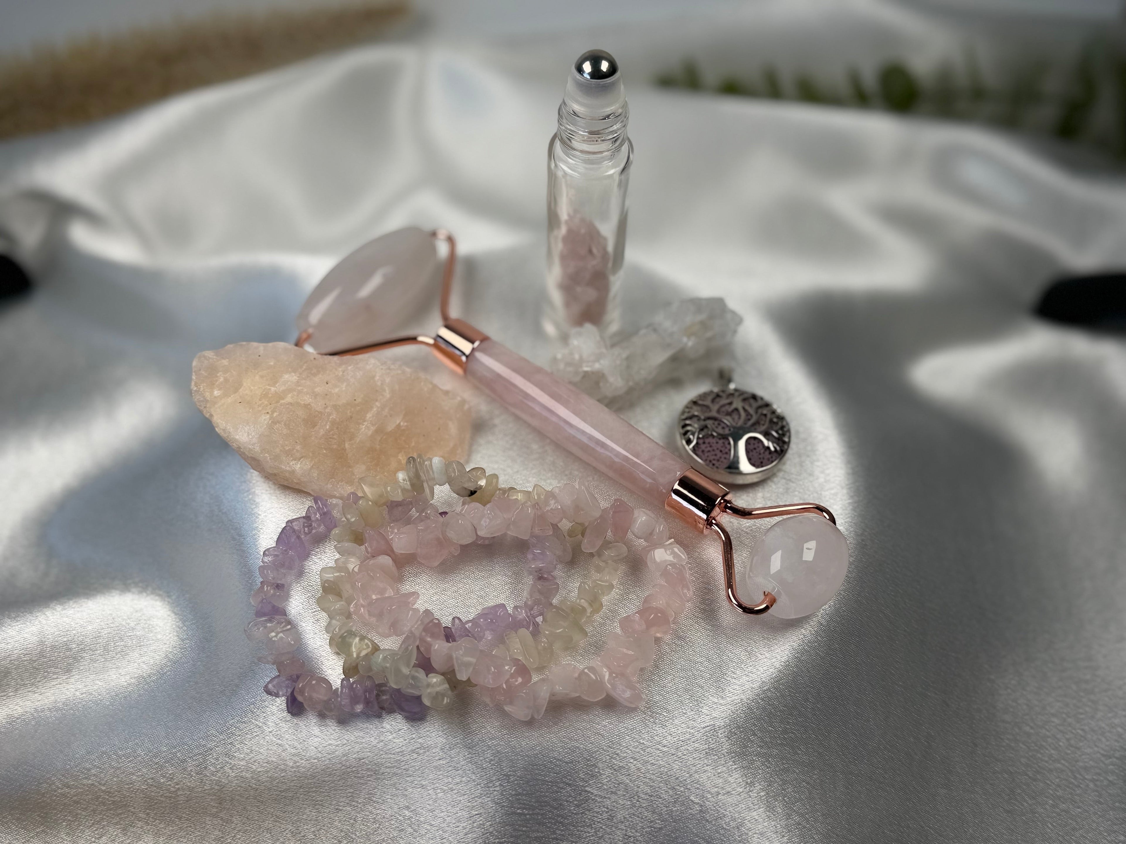 Treasured Energies rose quartz face roller gift set with crystal chip bracelets and essential oil roller bottle
