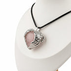 Treasured Energies rose quartz heart crystal pendant with silver angel wings on a black cord necklace