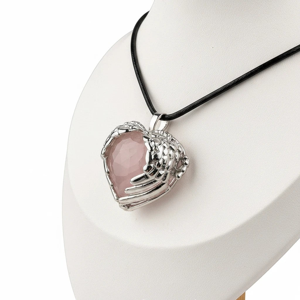Treasured Energies rose quartz heart crystal pendant with silver angel wings on a black cord necklace