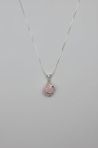 Treasured Energies rose quartz crystal pendant necklace with silver wire wrapping on a delicate silver chain