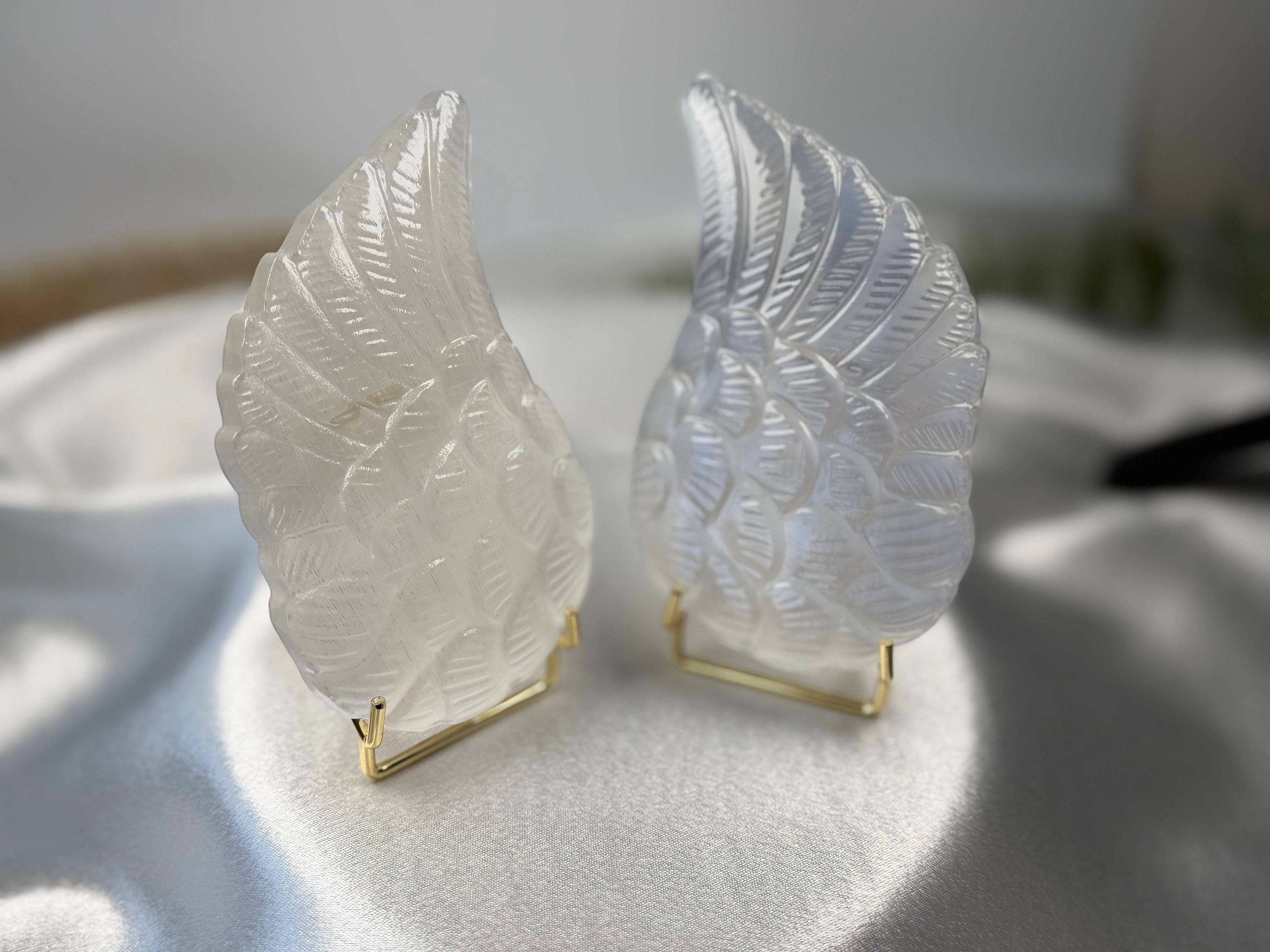 Treasured Energies pair of carved white selenite angel wings on gold metal stands for spiritual home decor