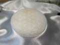 Treasured Energies 14cm round white selenite charging plate with a delicate engraved flower of life pattern