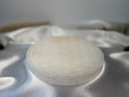 Treasured Energies 14cm round white selenite crystal charging plate with a delicate engraved flower of life pattern.