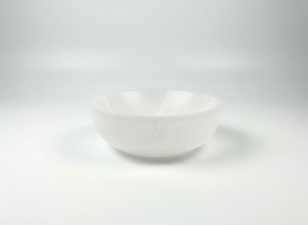 Treasured Energies hand carved white selenite crystal bowl for cleansing and charging gemstones on a white background