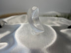 Treasured Energies hand carved translucent white selenite crescent moon crystal sculpture on a satin surface